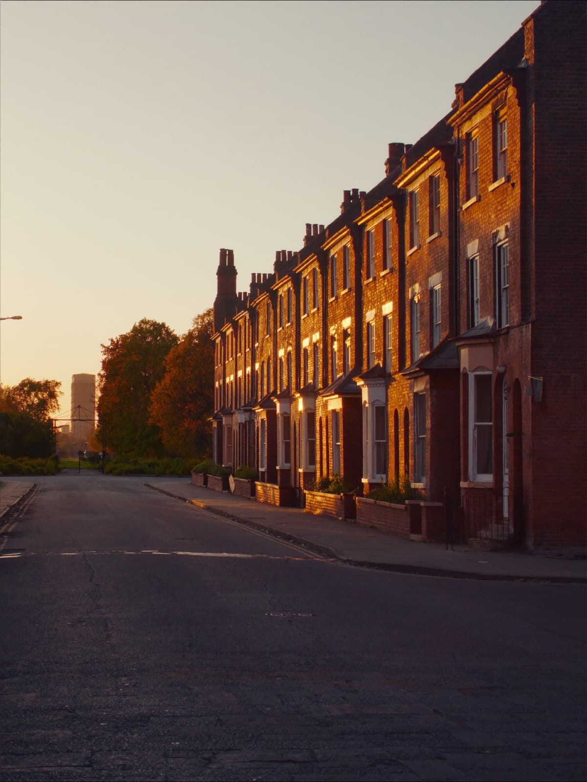 Red-brick Tyneside flat terraces in evening light, Heaton